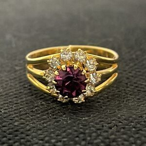 Beautiful ring with a purple rhinestone